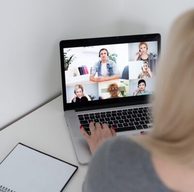 Woman taking a virtual meeting with her coworkers