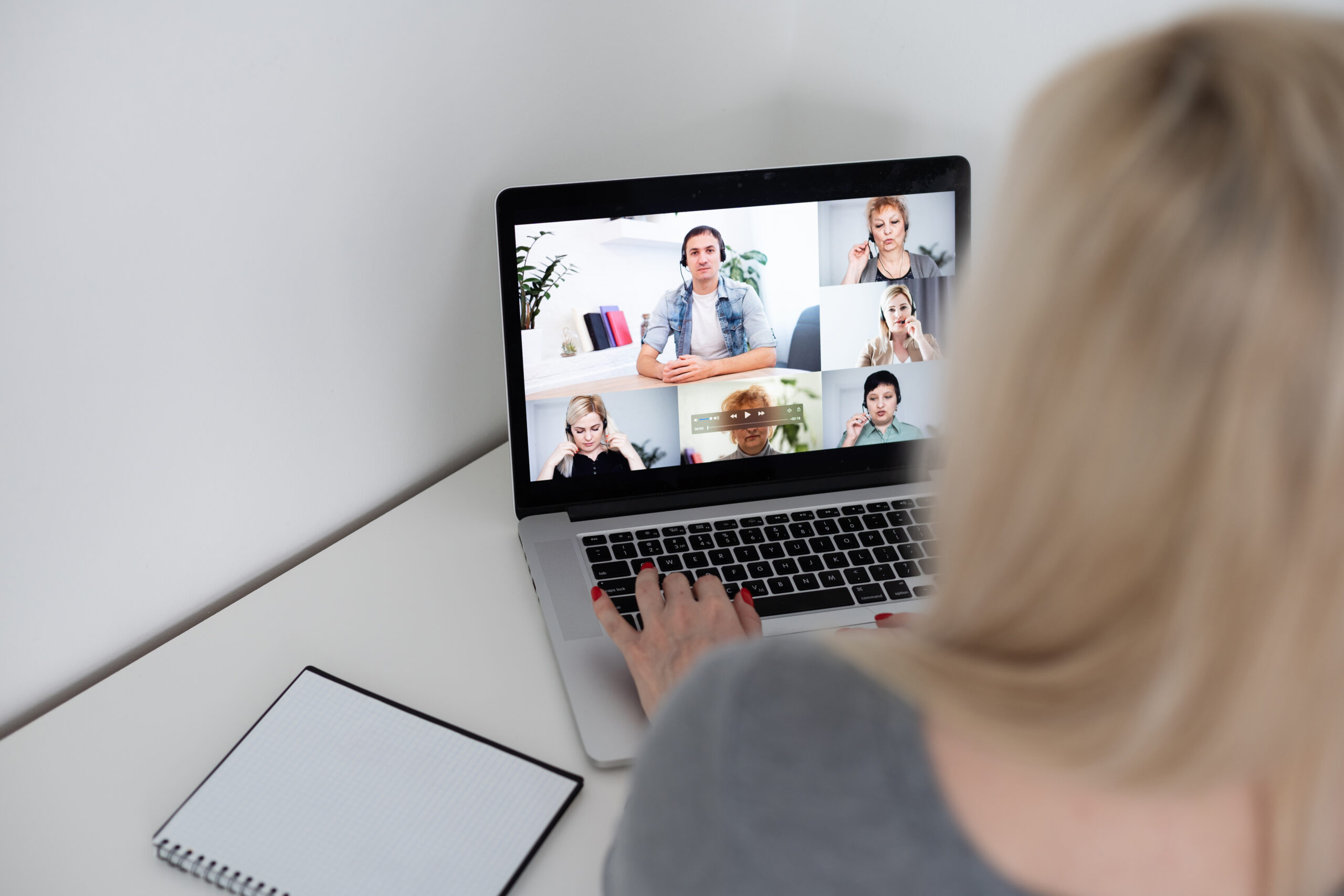Woman taking a virtual meeting with her coworkers